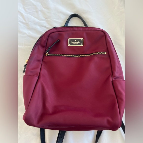 kate spade Handbags - Kate Spade Red Backpack with Sleek Design and Durable Material